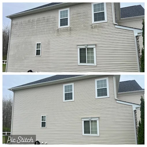 Two-story beige vinyl siding house with white trim and gray roof